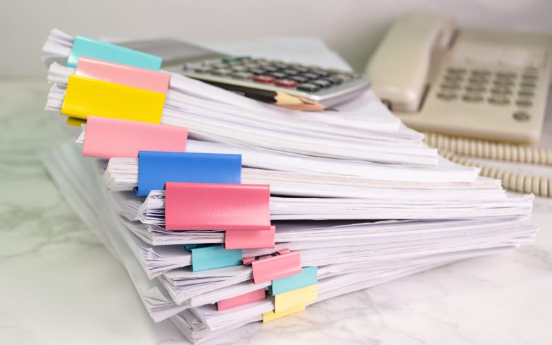 file folder and Stack of business report paper file on the table in a work office, concept document in work office